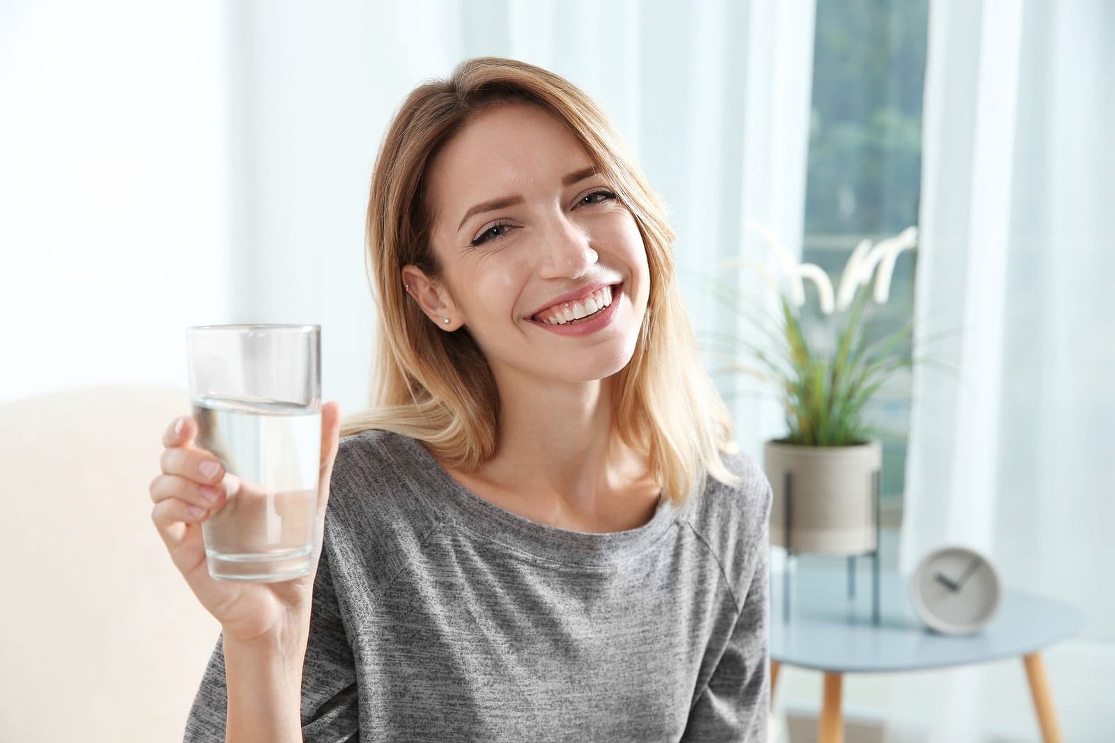 fewa-main-imageye___-_imgi_6_bigstock-Young-Woman-Holding-Glass-With-264566257.jpg