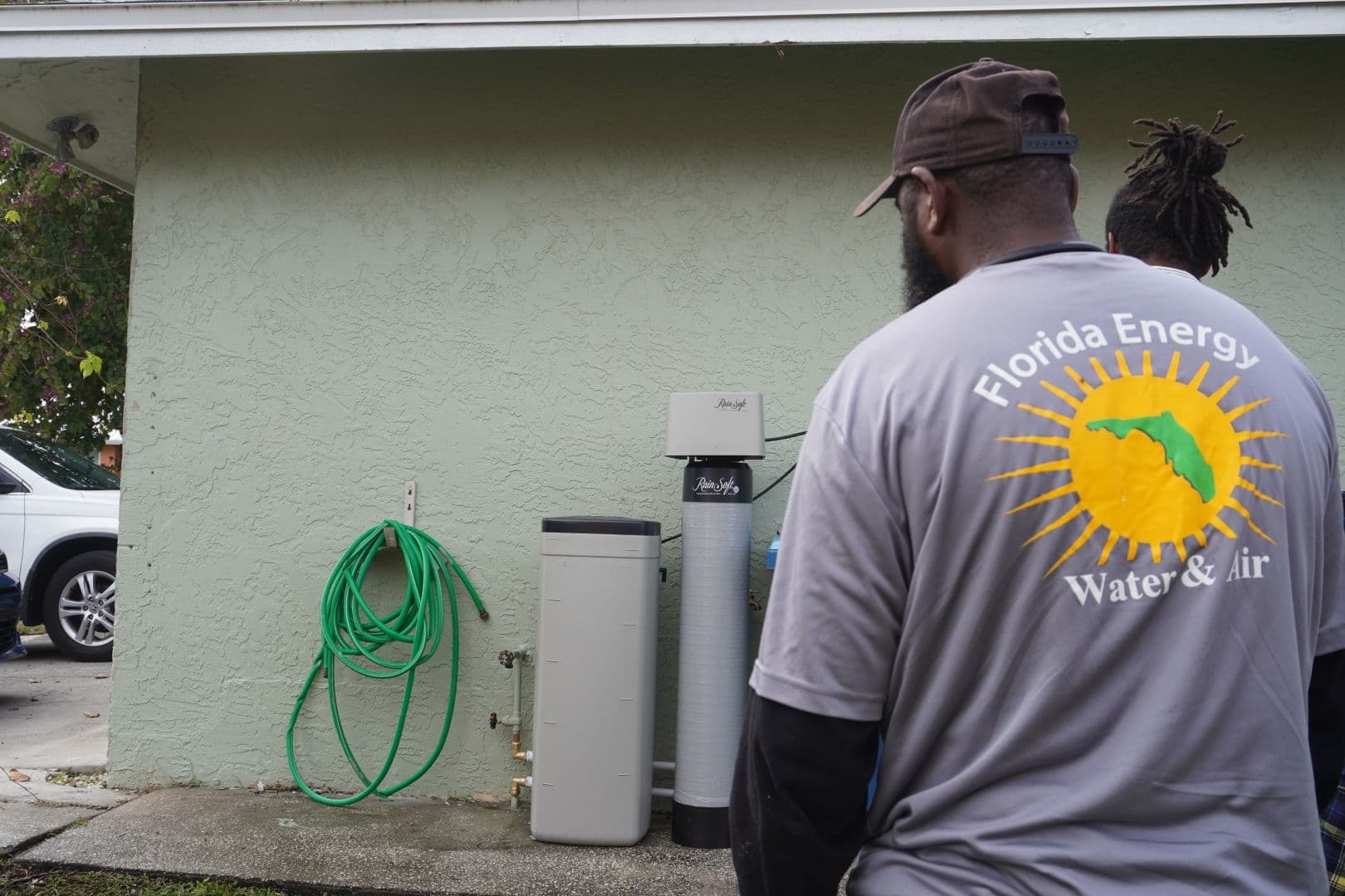 FEWA employees install a water treatment system.